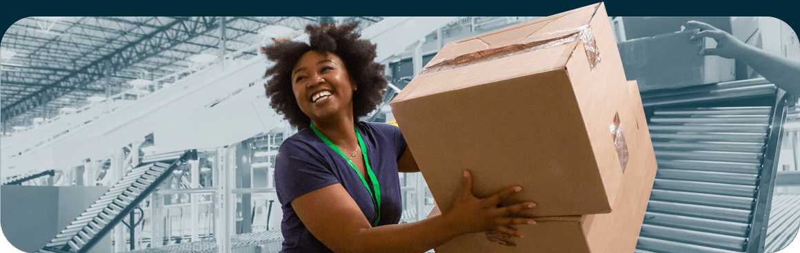 Woman holding moving boxes